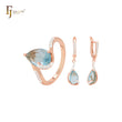 Solitario de circonita rosa en forma de pera con circonitas blancas. Conjunto de joyas de oro rosa de dos tonos con anillos.