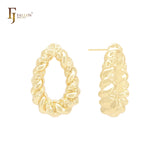 Pendientes tipo lágrima de oro de 14 quilates, oro rosa y oro blanco con textura irregular.