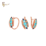 Conjunto de joyería de oro rosa con anillos y concha abierta que incluye cinco circonitas azules mixtas