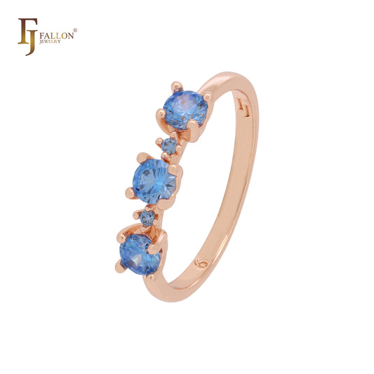 Anillos de compromiso en oro rosa con circonitas cúbicas de triple redondeo en azul océano profundo