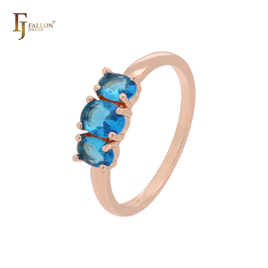 Anillos de compromiso de oro rosa con triple racimo de circonitas azul océano