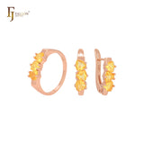 Conjunto de joyas con anillos en oro rosa y circonitas triangulares, triple champán, naranja y amarillo