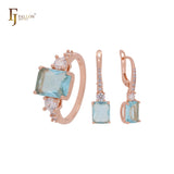 Schmuckset aus Roségold mit Ringen und weißen und seeblauen Zirkonia im Smaragdschliff