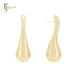 Pendientes largos y retorcidos de oro de 14 quilates, oro rosa y oro blanco.