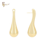 Pendientes largos y retorcidos de oro de 14 quilates, oro rosa y oro blanco.