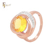 Anillo de moda de oro rosa en dos tonos con circonita cúbica amarilla y solitario grande de triple giro.